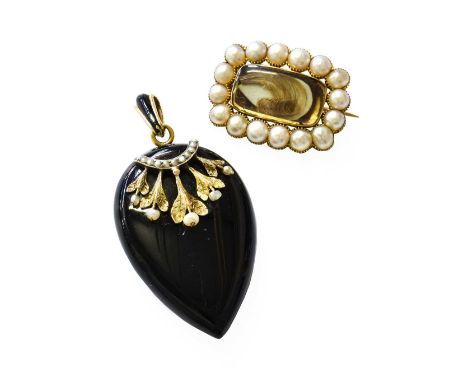 A Victorian Seed Pearl and Jet Pendant, the pear shaped jet overlaid with split pearl and seed pearls, suspended from a black