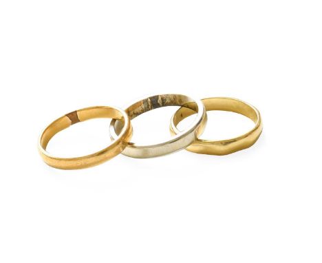 A 22 Carat Gold Band Ring, finger size N1/2; An 18 Carat Gold Band Ring, finger size M1/2; and Another Ring, stamped '750', f