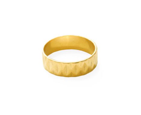 A Textured 22 Carat Gold Band Ring, finger size VGross weight 6.4 grams.