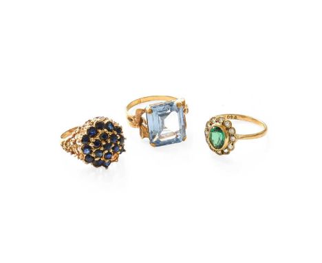 A Synthetic Blue Spinel Ring, finger size P; A Synthetic Green Spinel Cluster Ring, finger size O; and A 9 Carat Gold Sapphir