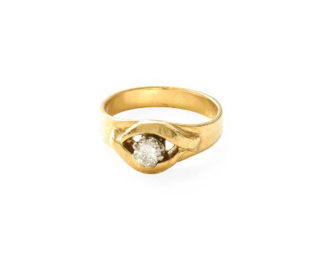 A Diamond Solitaire Ring, the round brilliant cut diamond in a white claw setting, within a yellow openwork surround, on plai