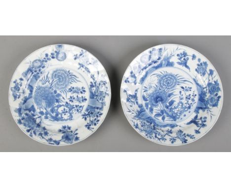 A pair of Chinese Kangxi blue and white dishes decorated in underglaze blue with flowers. Bearing incense burner mark to base
