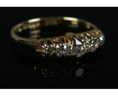 An 18ct Gold and five old stone cut diamond ring. Size K. Total weight: 2.2g  