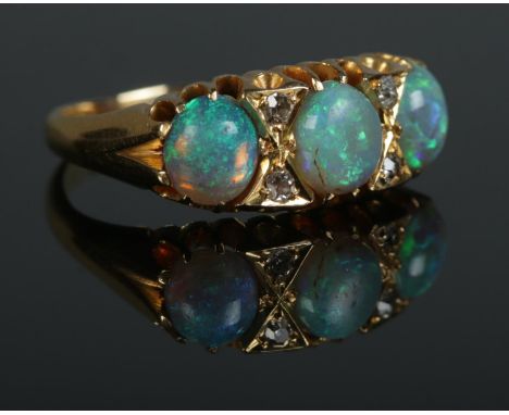 An Edwardian 18ct gold, opal and diamond ring. Size N. 3.99g.  