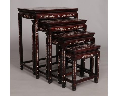 A quartetto of Oriental nesting tables with mother of pearl inlaid decoration. Biggest table - Height 65.5cm, Width 51cm, Dep