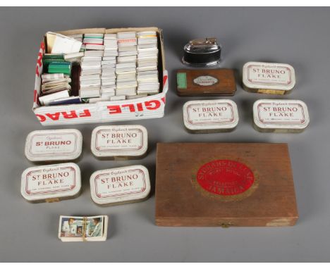 A collection of smoking related items to include Ogden's tobacco tins, large collection of matchboxes, table lighter, etc.  