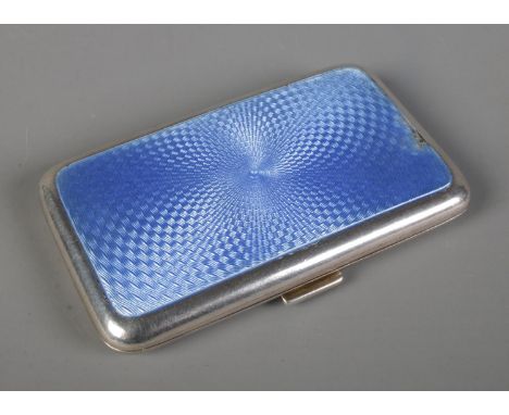 A silver and blue enamel cigarette case, Charles Perry &amp; Co, Chester 1929, 70g, 8cm long.  Some damage to enamel waring a