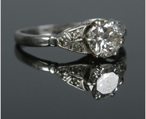 An Art Deco platinum and diamond ring. Size L. 3.18g. Central diamond just over 0.5ct.  