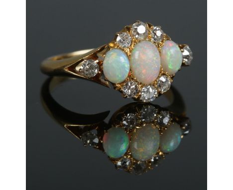 An early 20th century 18ct gold, opal and diamond cluster ring. Hallmarks for Birmingham, 1912. Size N 1/2. 3.71g.  