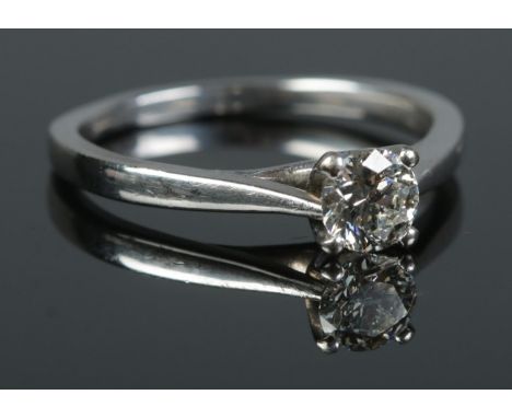 An 18ct white gold diamond solitaire ring. The round brilliant cut diamond 0.5ct. With certificate. Size N. 3.22g.  