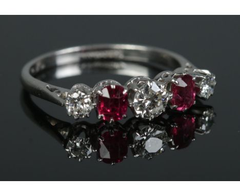 An early 20th century platinum, diamond and ruby five stone ring. Size L. 2.59g.  