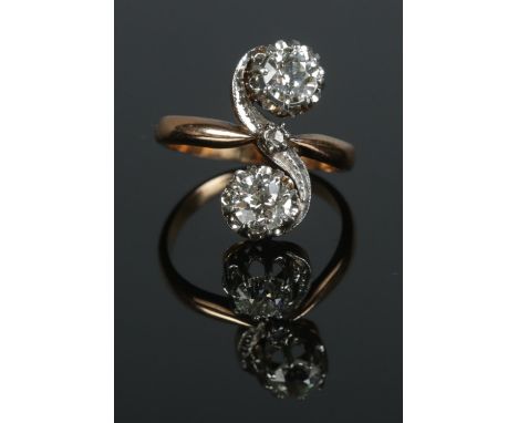 An antique gold two stone diamond ring. Each stone approximately 0.5ct. Size L 1/2. 4.94g.  