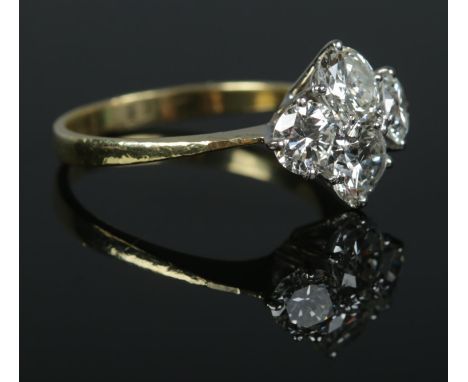 An 18ct gold and four stone diamond ring. The diamonds being round brilliant cut (approximately 2ct). Size O. 3.48g.  