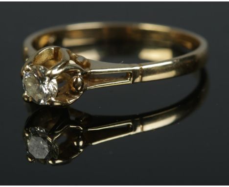 An 18ct diamond solitaire ring. Size P.  