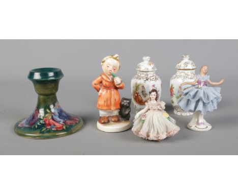 A collection of ceramics to include Moorcroft Anemone pattern candlestick, Dresden lacework dancer figures, etc.  All pieces 