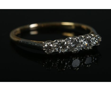 A 18ct Gold and Platinum five stone diamond ring. Size Q. Total weight: 2.2g  