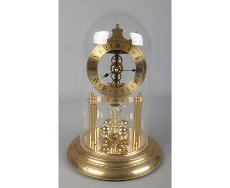 A Haller torsion clock under glass dome.  