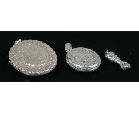 Two silver hinged lockets, together with a small silver amulet in the form of a clenched fist. Total weight: 39.7g  