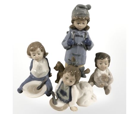 Four Nao figures of children, tallest 19.5 cm.