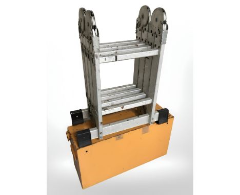 An enamelled metal tool chest and a folding aluminium ladder  