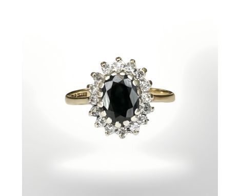 A 9ct yellow gold sapphire and diamond cluster ring, size H/I CONDITION REPORT: 1.9g.