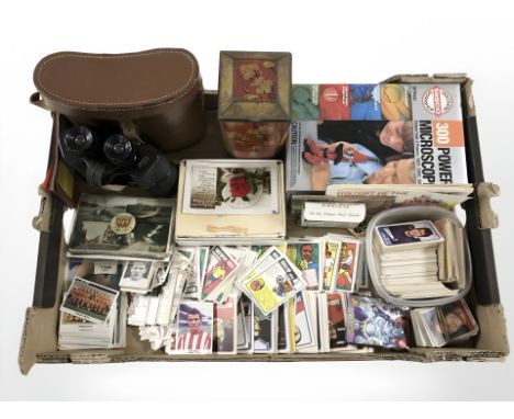 A quantity of football trading cards, boxed microscope, pair of Prinz 10x50 binoculars, Marvel trading cards, etc. (1 box)