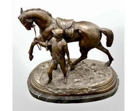 After Edgar Bertram : A bronze statue depicting a jockey with racehorse, on a black marble plinth, 52 cm x 47 cm.
