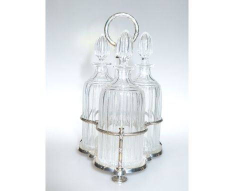 Elkington & Co. silver plated three bottle decanter stand with three cut glass decanters