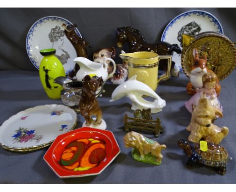 A COLLECTION OF POTTERY ANIMALS to include Poole, Sylvac, Wade USSR, three items of Welsh Lady memorabilia, two Doulton displ