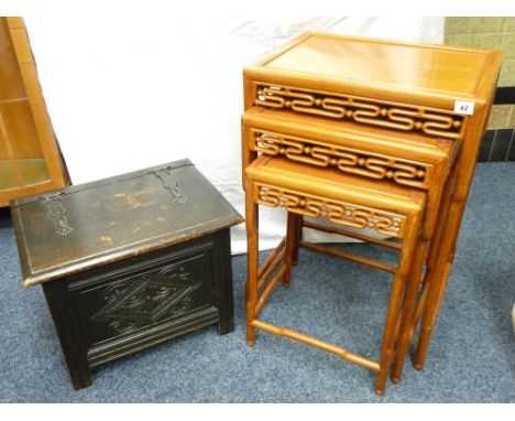 ORIENTAL HARDWOOD COFFEE TABLES, a nest of three oblong topped with patterned aprons and 'bamboo stretchers'; a polished and 