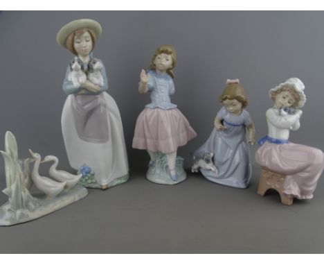 FOUR NAO PORCELAIN FIGURINES and a small group study of ducks, 25.5cms height the tallest