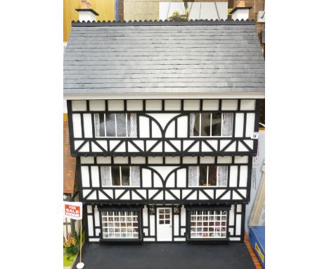 THE LADIES' SHOP - A half timbered Tudor style three storey house under a slate roof, fully furnished, with period style furn