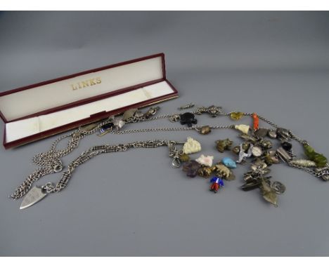 AN UNUSUAL ENAMEL GOLLY FIGURE, forty nine further charms and a silver Albert T Bar and clip with shield fob marked 'Bettws Y