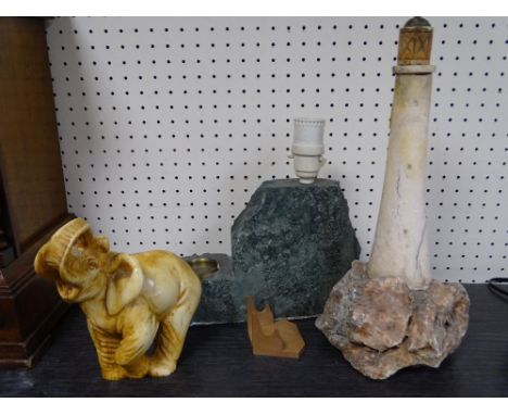 A STONEWARE LIGHTHOUSE TABLE LAMP, another similar stoneware lamp and a composition elephant ornament