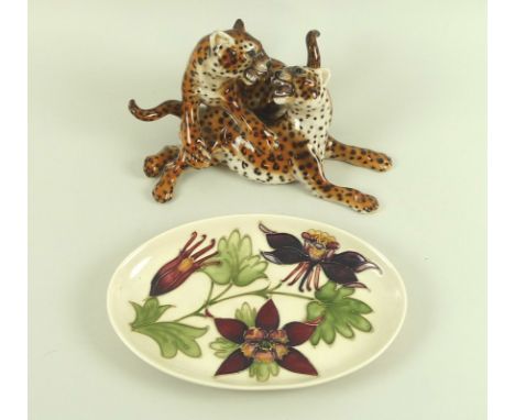 A Moorcroft oval tray, decorated in the Columbine pattern, signed to base, 23 by 15.5cm, together with and Italian ceramic mo
