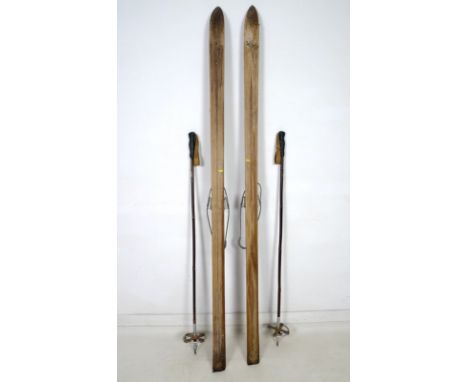 A pair of vintage skis, early to mid 20th century, Nr 1 by Hedbergsskidan, Edsbyn, Sweden, serial A038973, 7 by 188cm, and a 