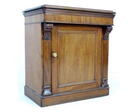 A Victorian mahogany wash stand, lift lid revealing a hinged mirror and cut outs to the surface for bowl, dish and jug, cupbo