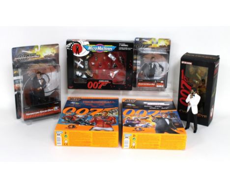 A group of five James Bond action figures, comprising two Action Man 12 inch collector's figures, from Thunderball and Tomorr