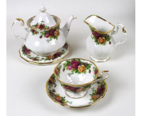 A Royal Albert part dinner and tea service decorated in the Old Country Roses pattern, comprising eight tea cups, 11 by 8.3cm