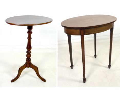 A Victorian mahogany occasional table, with oval tilt top, raised on baluster supports and tripod base, 50 by 39 by 72.5cm hi