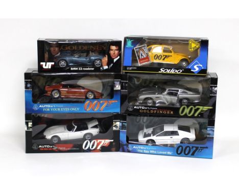 A group of six 1/18 scale die cast replica models, all boxed, comprising BMW Z3 Roadster, from Goldeneye, by UT Models, 2CV J