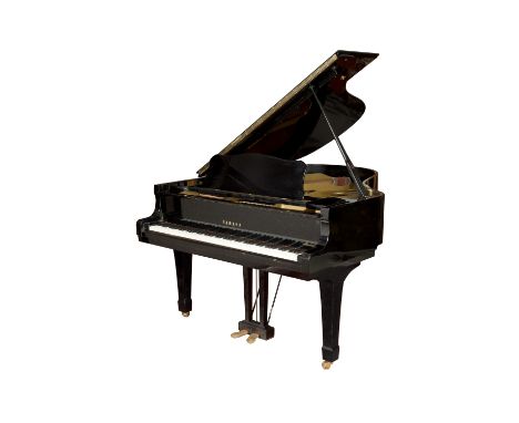 A Yamaha C3 conservatory grand piano in a bright ebonised case, frame number B2143924, circa 1975, on square section tapering