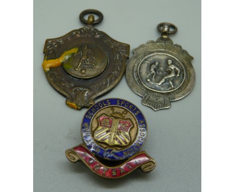 A silver football fob medal with Mascot Cup inscription, one other football fob medal with inscription, West Ham Directors Cu