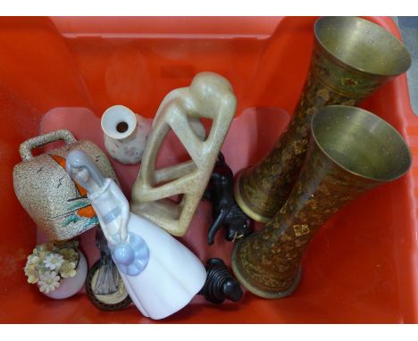 A pair of Indian brass vases, an ebony model of a lion and walrus, a Spanish figure, Wedgwood vase, ceramic cow bell, etc.**P