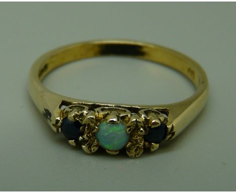 A 9ct gold, opal and sapphire ring, 2g, O 