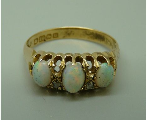 An 18ct gold, opal and diamond ring, Birmingham 1919, 3.1g, M 