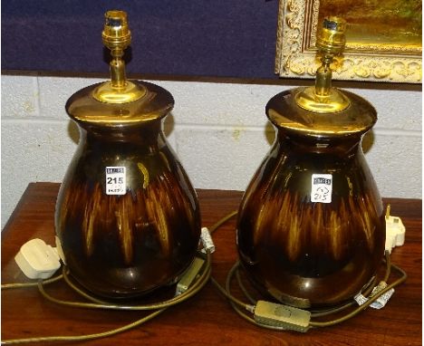 A pair of Poole pottery 'Precious' design table lamps, in the Ruskin style on glazed brown ground, lacking shades (2)