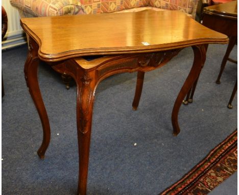 A 19th century French style mahogany card table, the shaped swivel top enclosing backgammon interior with pieces, a screw mec