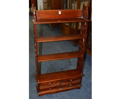 A reproduction open wall shelf in the Victorian style, with open shelving above two sets of small drawers, 111cm high x 60cm 