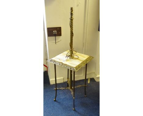 A brass and onyx lamp table, with pierced foliate decoration raised on barley twist supports, 125cm high